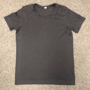 Black size 6 Lululemon shirt. High tech sweat wicking fabric,very breathable.
